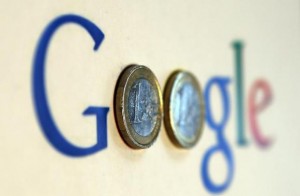 An illustration picture shows a Google logo with two one Euro coins